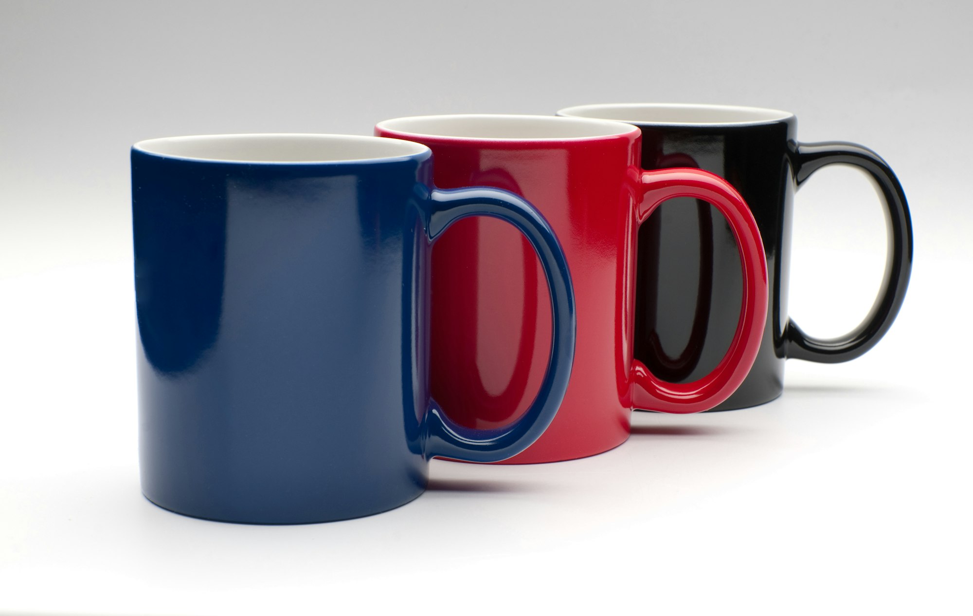 three colorful cups